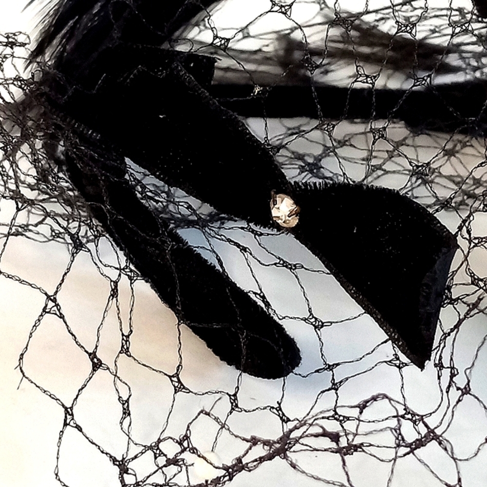Antique Black Felt and Feather Hat with a rhinestone on ea bow.